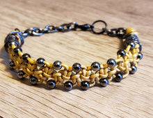 Load image into Gallery viewer, Metallic Gold Leather Bracelet with Black Czech Glass Beads &amp; Hemotite colored Stainless Steel Chain, Adjustable up to 7.5&quot; with Lobster Claw Clasp.
 