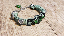 Load image into Gallery viewer, Black Leather &amp; Natural Green Hemp Bracelet with Czech Glass and Silver Plated Shell Beads, Adjustable with Lobster Claw Clasp.
 